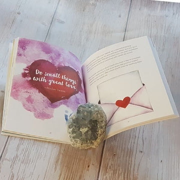 Example of page in The Joy of Now Journal by Paige Burkes on a wooden table